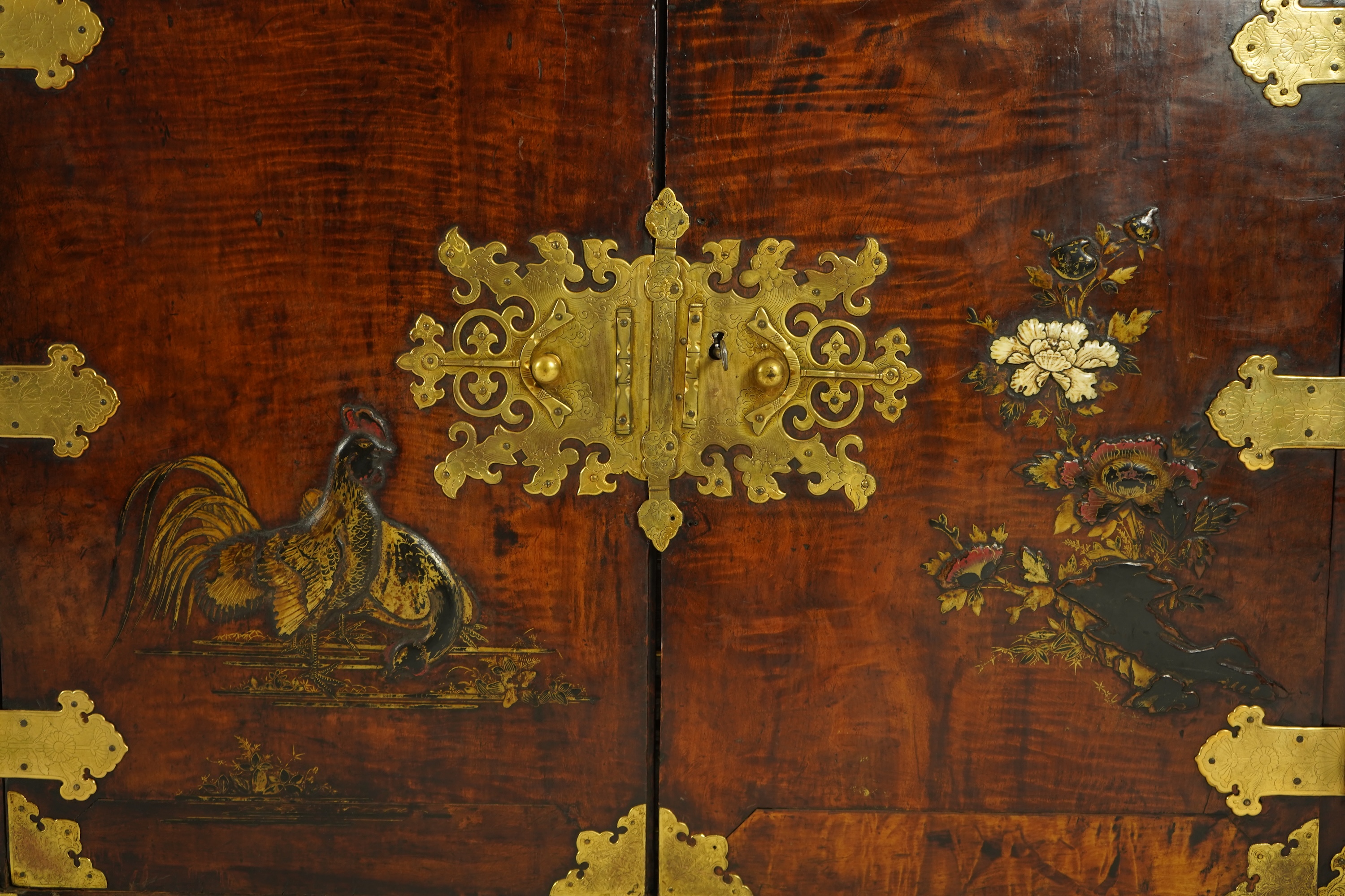 A Japanese mulberry wood, hiromaki-e lacquer and gilt copper mounted cabinet, c.1680-1700